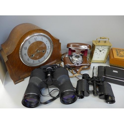 705 - Two pairs of binoculars, a chiming mantel clock, two cameras, a light meter and a musical jewellery ... 