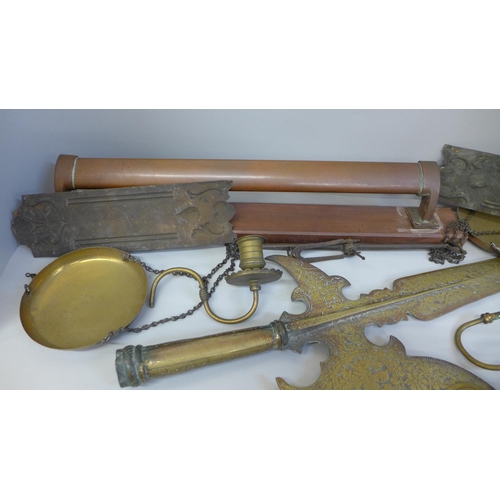 716 - A box of metal ware including a brass pikestaff head, a sun dial, balance scales, etc.