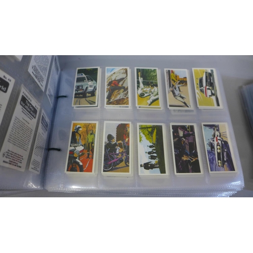 744 - A collection of cigarette card sets, mainly Wills and Players, including military, transport, vintag... 