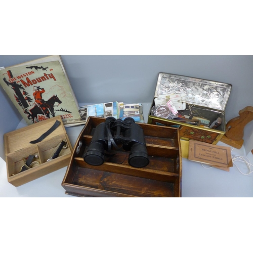 745 - A stamp album, a wooden cutlery tray, a tin, a pair of binoculars, etc.