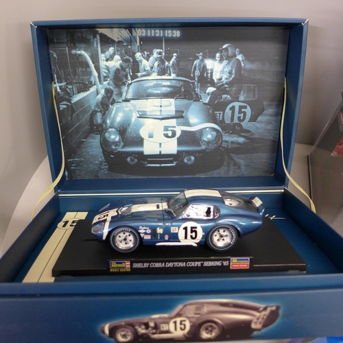 748 - Seven slot racing cars including Scalextric, Revell and Carrera, American models, Chevrolet Camaro, ... 