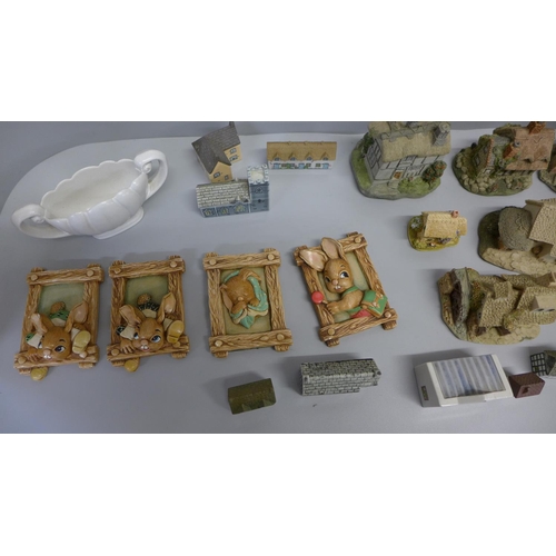 749 - A collection of Wade model houses, Lilliput Lane cottages, others, and four Pendelfin plaques