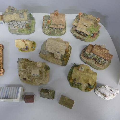 749 - A collection of Wade model houses, Lilliput Lane cottages, others, and four Pendelfin plaques