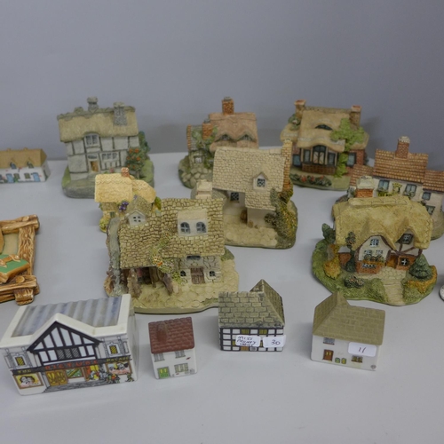 749 - A collection of Wade model houses, Lilliput Lane cottages, others, and four Pendelfin plaques