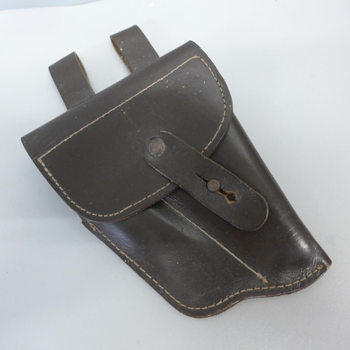 756 - A WWII US Airforce peaked cap and a leather holster