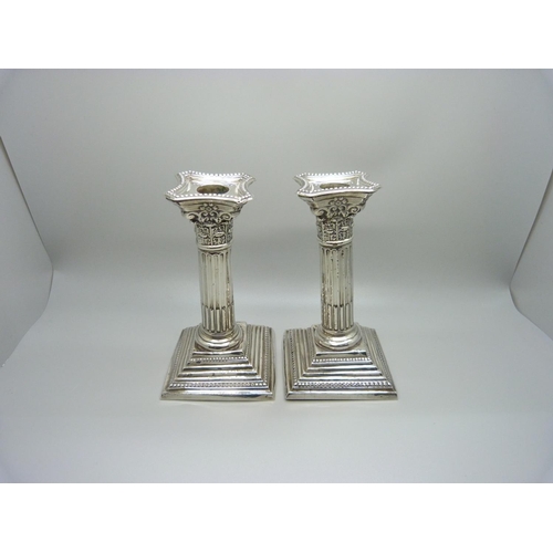 810 - A pair of silver candlesticks, 15.5cm, a/f