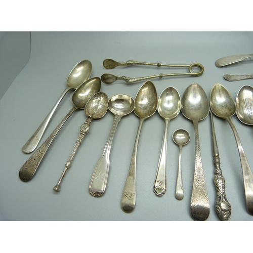 823 - A collection of silver spoons, etc., including a pair of 19th Century silver mustard spoons, 301g of... 