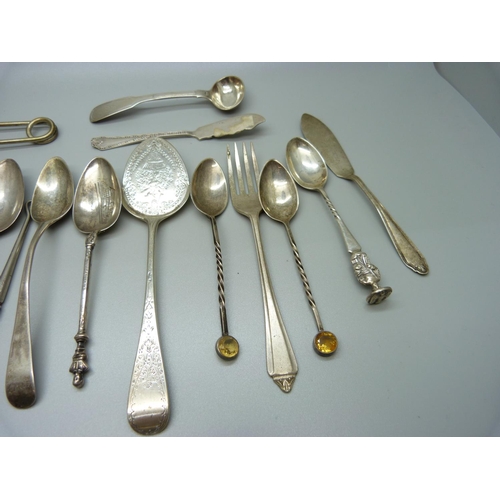 823 - A collection of silver spoons, etc., including a pair of 19th Century silver mustard spoons, 301g of... 