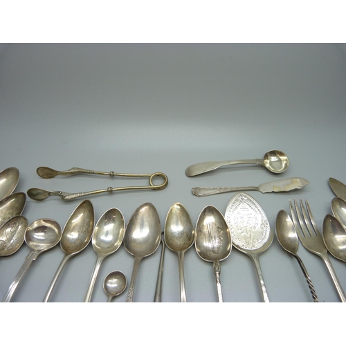 823 - A collection of silver spoons, etc., including a pair of 19th Century silver mustard spoons, 301g of... 