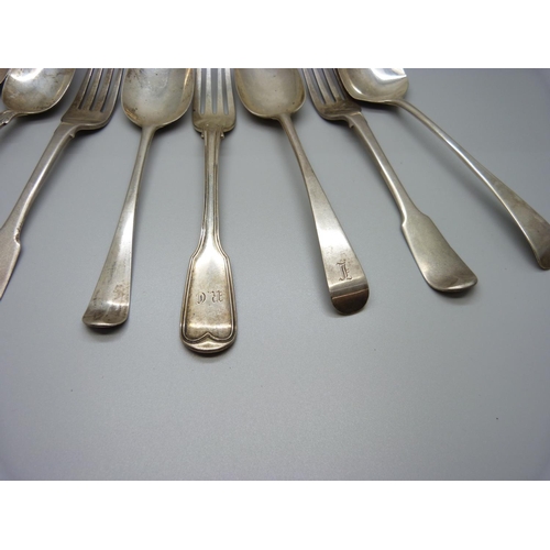 828 - A collection of 18th and 19th Century silver forks and spoons, including one spoon dated London 1771... 