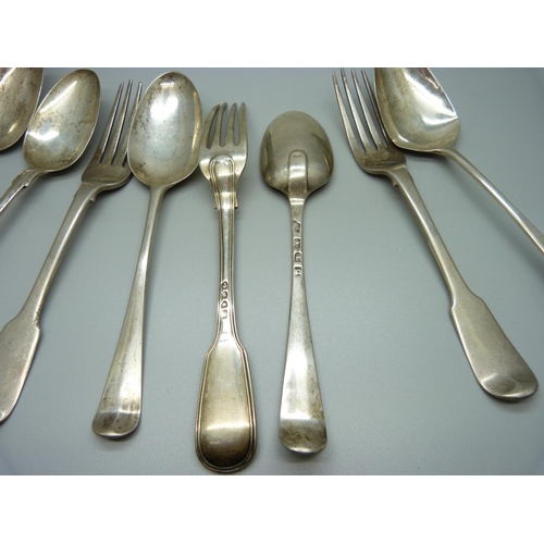 828 - A collection of 18th and 19th Century silver forks and spoons, including one spoon dated London 1771... 