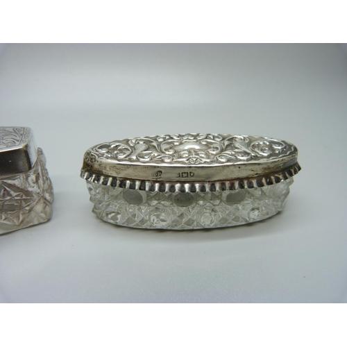 829 - Two silver topped glass jars, Chester 1915 and London 1910, largest 103mm