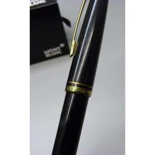 841 - A Mont-Blanc fountain pen with 14ct gold nib, box and papers and a pot of black ink