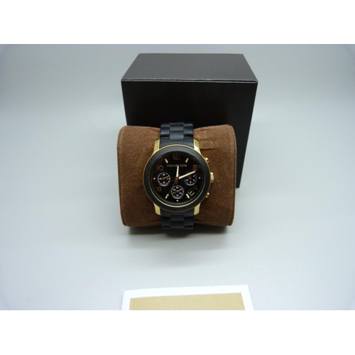 845 - A Michael Kors copper and black designer wristwatch, with box and spare links