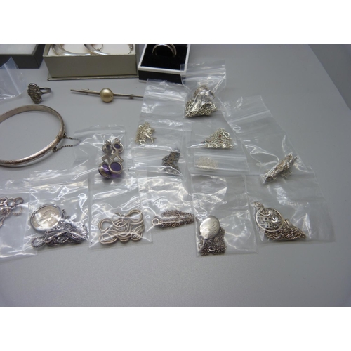 883 - A collection of silver jewellery including a baby's bangle, and two boxed 'Crystal Chain' items