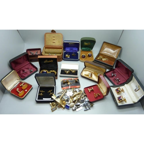 892 - A collection of cufflinks and tie-pins including Spitfire