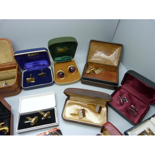 892 - A collection of cufflinks and tie-pins including Spitfire