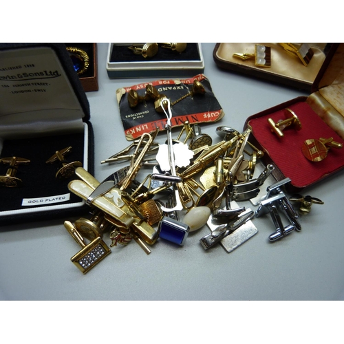 892 - A collection of cufflinks and tie-pins including Spitfire