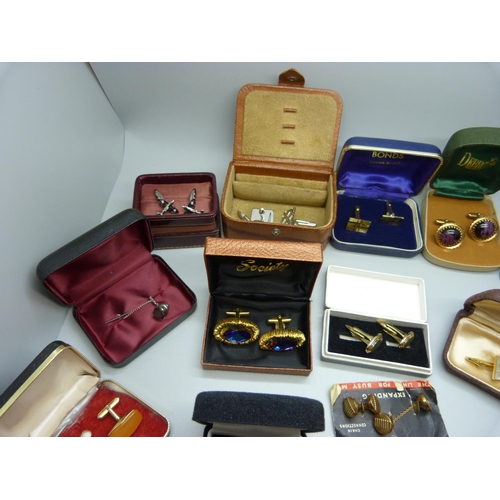 892 - A collection of cufflinks and tie-pins including Spitfire