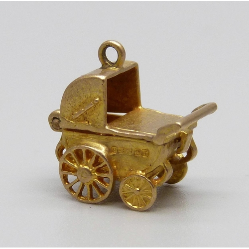 911 - A hallmarked 9ct gold pram charm, 3g