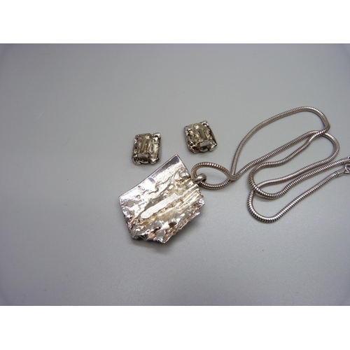 918 - A retro designer necklace and earrings by Charles Diviet