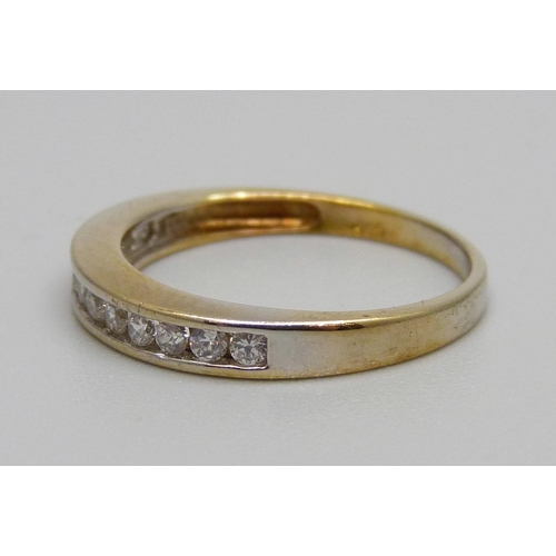 928 - A silver gilt and white stone ring, M