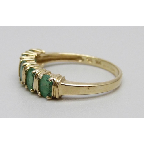 932 - A 14ct gold five stone emerald ring, 2.9g, R