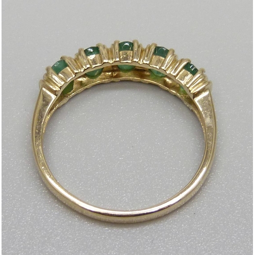 932 - A 14ct gold five stone emerald ring, 2.9g, R