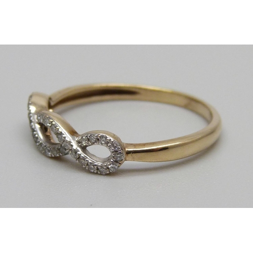 936 - A 9ct gold, 35 stone diamond crossover ring, 1.4g, N