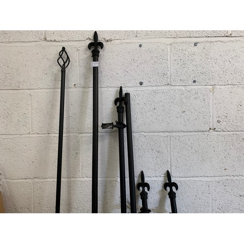 2291 - 5 mixed size black curtain poles with twist and fleur de lys finals