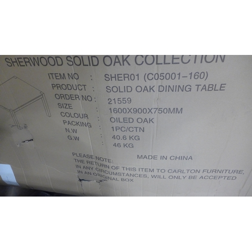 1403 - A Sherwood solid oak rectangular 1.6m dining table and bench *Boxed, Unchecked*