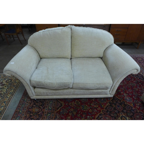 105 - A Duresta Harrington Hogarth two piece sand fabric lounge suite, comprising three seater settee and ... 