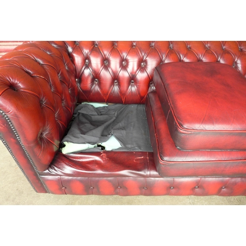 105c - A red leather Chesterfield three seater sofa, a/f