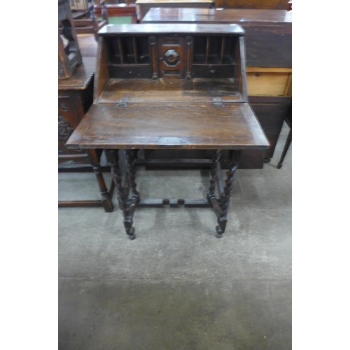 116 - A Victorian Jacobean Revival oak geometric moulded barleytwist bureau