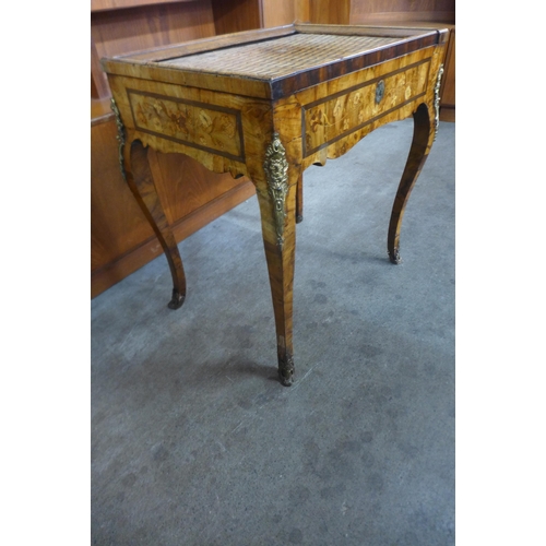 121 - A French marquetry inlaid walnut and ormolu mounted lady's desk, with tambour parquetry top