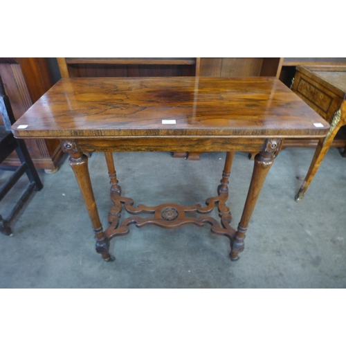 122 - A William IV rosewood fold over games table