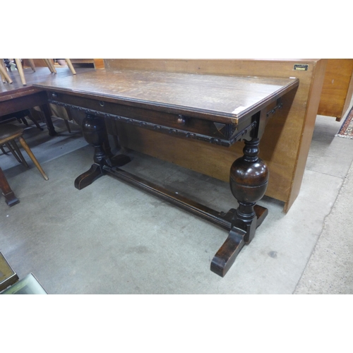 137 - A 17th Century style oak extending refectory table