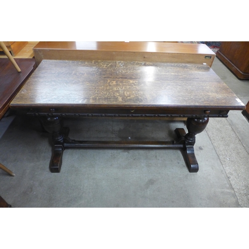 137 - A 17th Century style oak extending refectory table