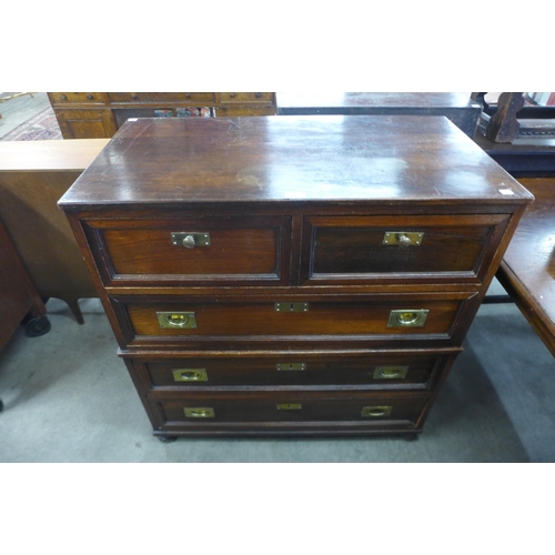 143 - A campaign style teak and brass mounted chest of drawers