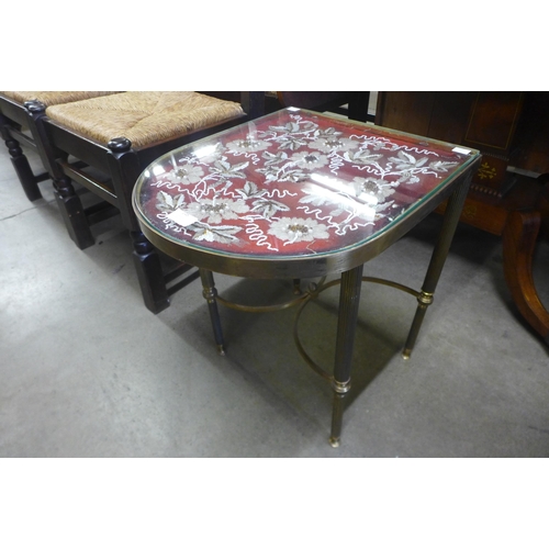 148 - An Italian brass D-shaped occasional table, with embroidered inset top