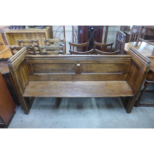 159 - A Victorian carved oak linenfold church pew