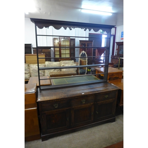 173 - A George III style oak dresser