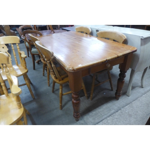 190 - A pine two drawer farmhouse kitchen table and six beech chairs