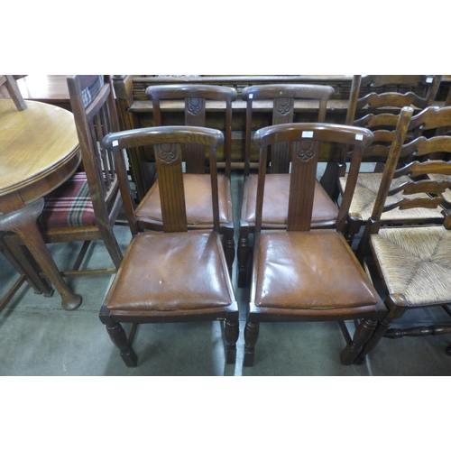 197 - A set of four oak dining chairs