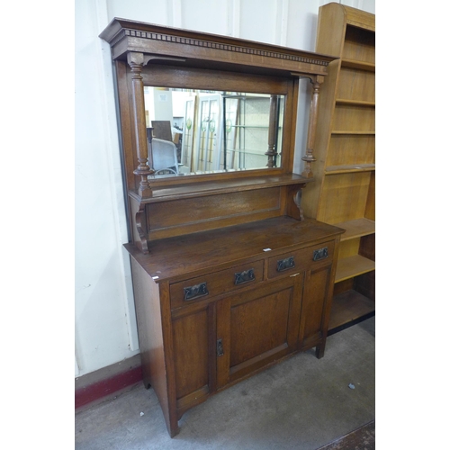 203 - An Arts and Crafts oak mirrorback sideboard