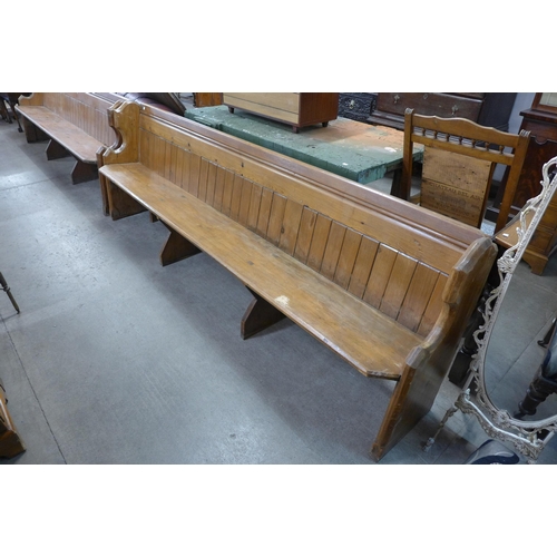 218 - A pair of Victorian pine church pews