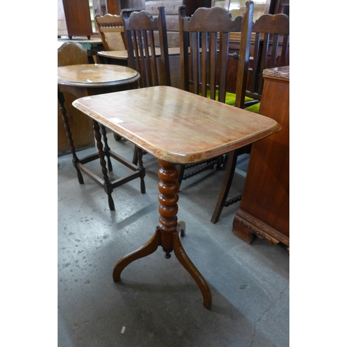 221 - A Victorian walnut tripod table