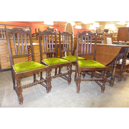 224 - A set of four walnut dining chairs