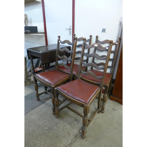 239 - A set of four oak dining chairs and a trolley