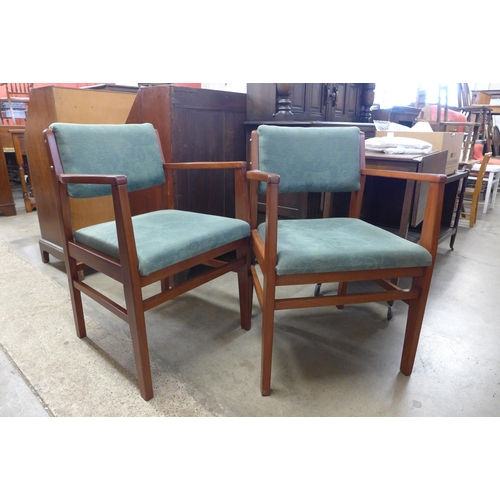 241 - A pair of teak armchairs